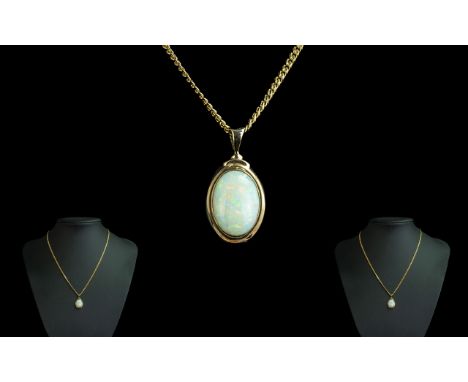 9ct Gold Attractive Opal Set Pendant Attached to a 9ct Gold Chain. Both Marked for 9.375. The Large Opal Shaped Opal of Good 