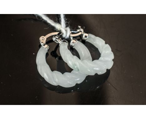 Carved White Jade Hoop Earrings, the jade carved into the appearance of a twisted rope and set in silver fittings, the hinged