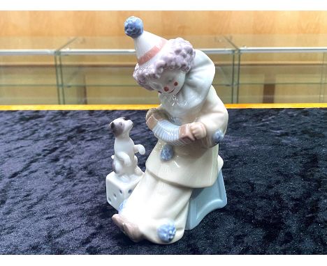 Lladro Pierrot Clown with Puppy &amp; Concertina.  No. 5279. Dated 1984, measures 6'' tall.