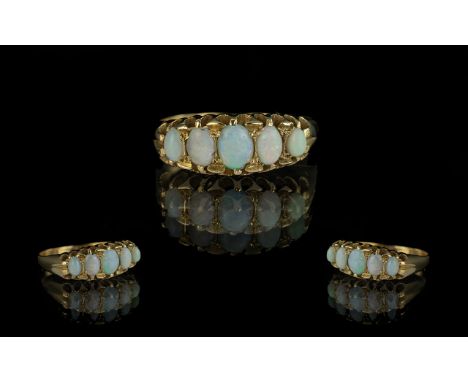 Antique Period Attractive 18ct Gold Five Stone Opal Set Ring, the well matched opals of good colours.  Gallery setting.  Not 