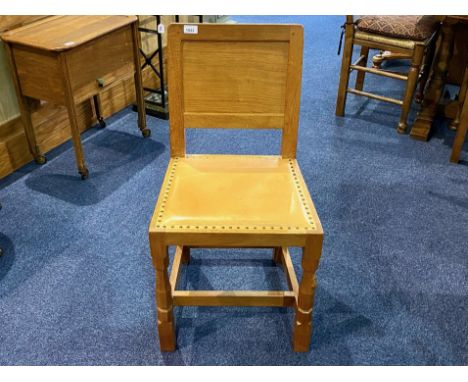 Workshop of Robert Mouseman Thompson of Kilburn (British, 1876-1955) Mouseman, Oak panel back dining chair with nail and hide