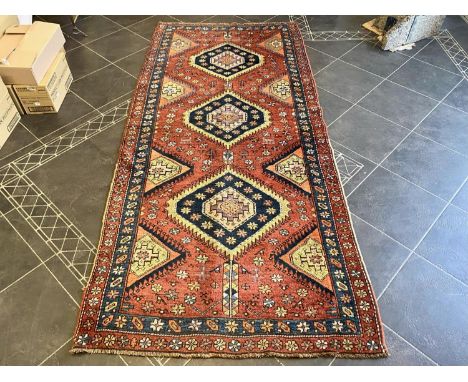 Terracotta Ground Persian Kashqai Nomadic Rug.  Approx 3 m x 120 cm.