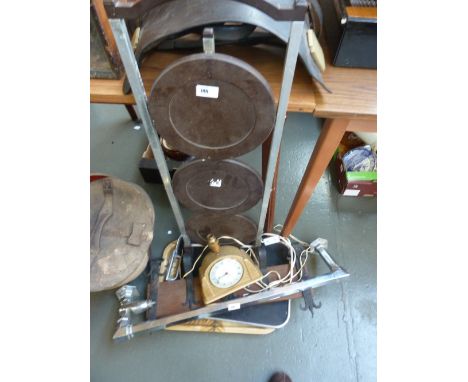 A clock lamp, a Bakelite cake stand, two Art Deco trays, a towel rail and some hooks
