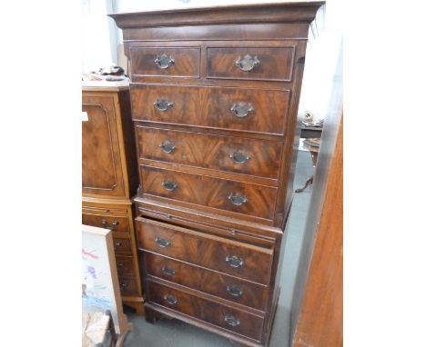 A 20th century mahogany tallboy, two short over six long drawers, with slide panel, raised on shaped bracket feet, 73cmW x 44
