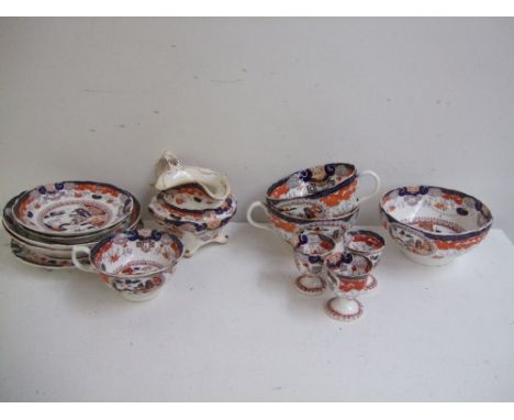A hand painted Japanese style part tea set, transferred, with hand painted gilt motifs over blue, orange and white ground. (1