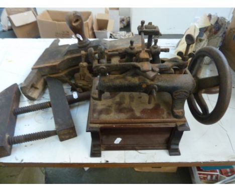 Vintage tools, including a Oliver Machinery Co. saw sharpener, with another, and two vintage bench vices