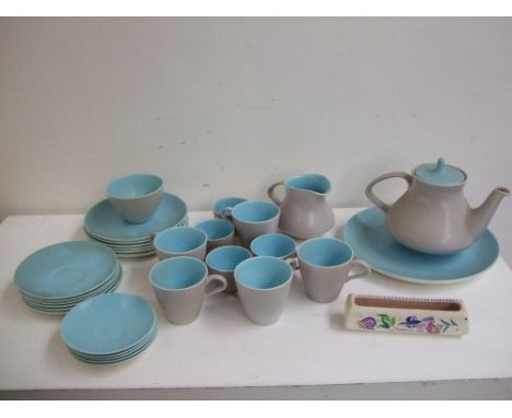 A blue Poole Pottery 'Twintone' part tea set with a trinket dish hand painted with birds by the same maker. (31)