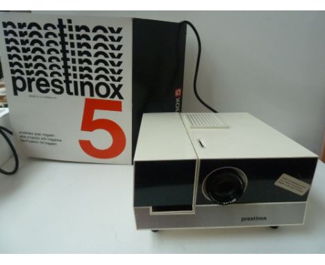 A boxed Prestinox 5 Slide Projector; a Voightlander VP200 Slide Projector, a boxed Panagor Zoom Slide Duplicator and various 