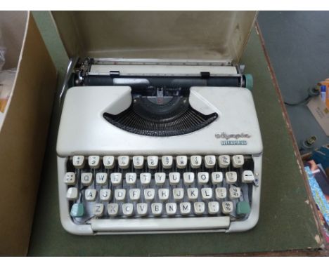Portable Olympia Splendid 66 typewriter with original case. 
