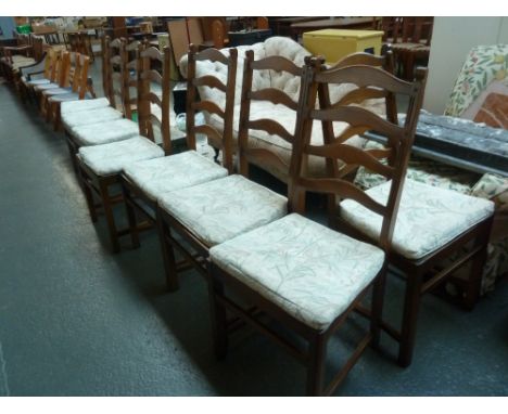 A set of eight Ercol elm ladderback chairs