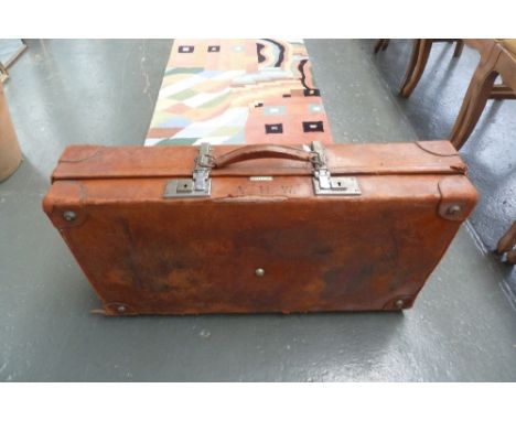 A vintage leather suitcase the "Revelation" with internal clothing straps with initials A H W;  front and rear extendable hin