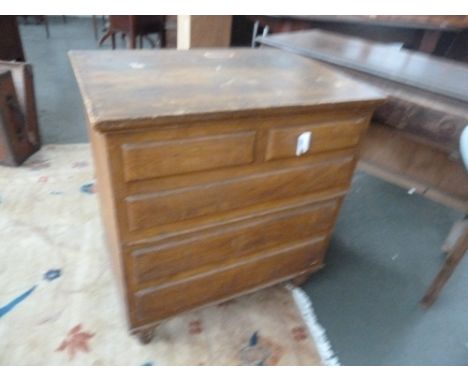 A Victorian pine commode, lift lid with bowl, raised on turned legs