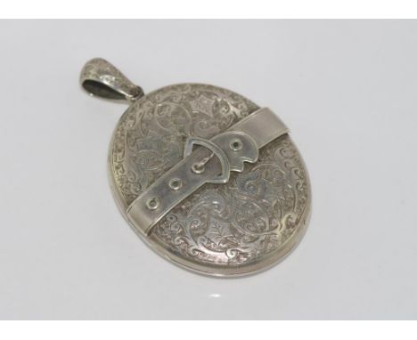 Vintage large locket with leaf and buckle design on front and plain on rear, size: 6 by 4 cm