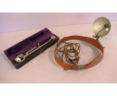 Vintage medical headlight lamp together with a cased Polar planimeter Stanley Great Turnstile Holborn London measuring instru