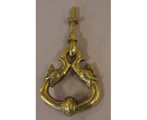 Large brass door knocker decorated with fish heads