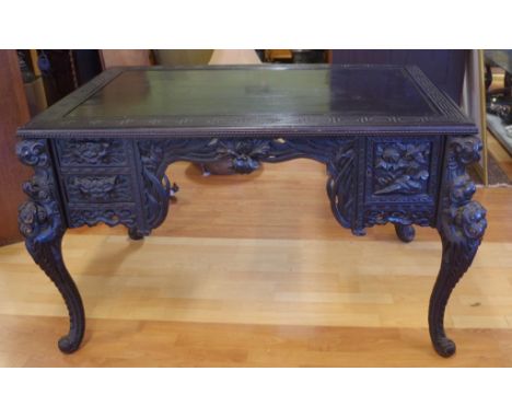 Ornately carved vintage Chinese lacquered desk with 2 drawers and a single door compartment to both sides, 130cm x 88cm, 76cm