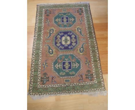 Vintage middle eastern woollen rug in green and brown tones, 173cm X 110cm approx