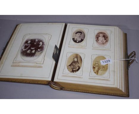 Antique 'White Flower' photograph album partially filled with mostly portrait photos, 29.5cm x 23cm