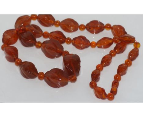 Vintage Baltic graduated honey amber necklace with long and round beads and amber clasp, would benefit from re-stringing, siz