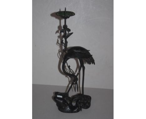 Japanese crane form bronzed candlestick as inspected, 38cm high approx