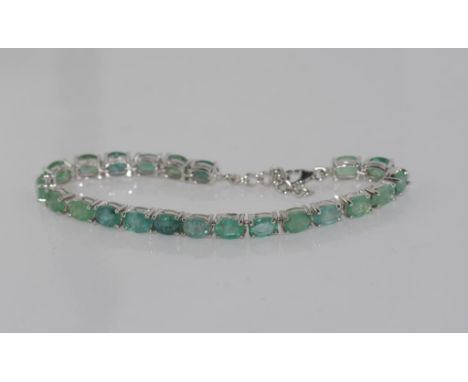 Sterling silver and emerald tennis bracelet