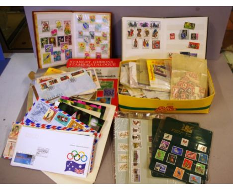 Quantity of Australian and world stamps to include first day covers, two albums, together with a Stanley Gibbons stamp catalo