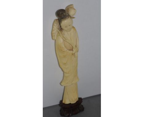 Antique carved ivory Chinese figure of a lady with lotus flower and leaf on stand, approx 26cm high (including stand), as ins