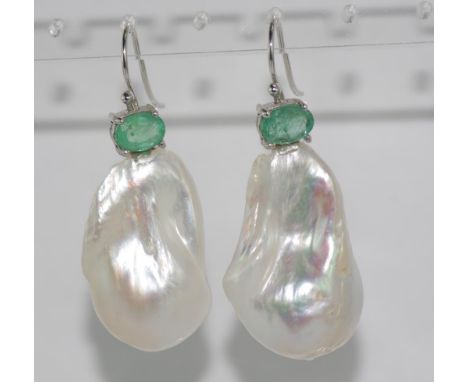 Large baroque pearl and emerald earrings on 9ct white gold hooks