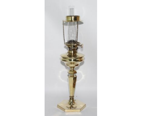 Well polished brass patent oil lamp standing on hexagonal column, height overall including funnel 28" high 