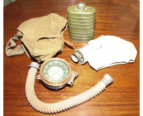 Russian gas mask and a vintage polish car clok 