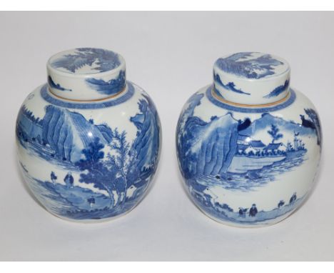 Pair of Chinese large blue and white porcelain ginger jars and covers decorated with figures in a lake and mountainous settin