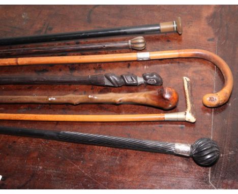Collection of 6 vintage walking canes to include two silver mounted examples 