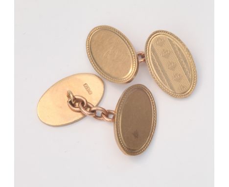 Pair of 9ct gold gents cufflinks of oval form with engine turned chevron design - weight 14.3g