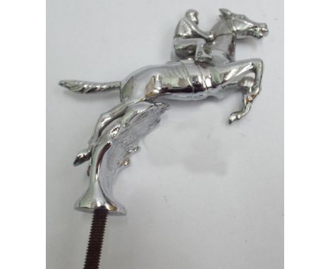 Vintage chrome car mascot depicting horse and jockey over a steeple chase fence, marked Desmo 17cm tall 