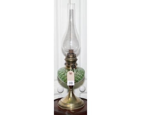 Brass oil lamp with green glass bowl 