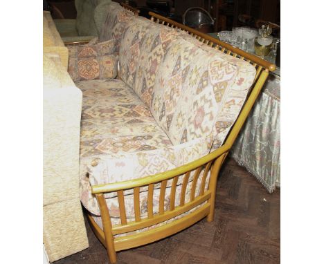 Ercol light oak framed 3 seater settee with fawn and figured patterned cushions together with one matching chair 