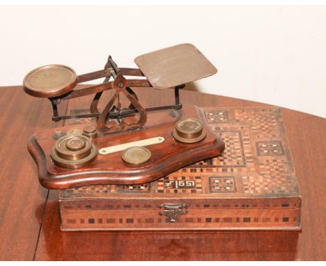 Eastern inlaid box and a set of brass letter scales and weights 
