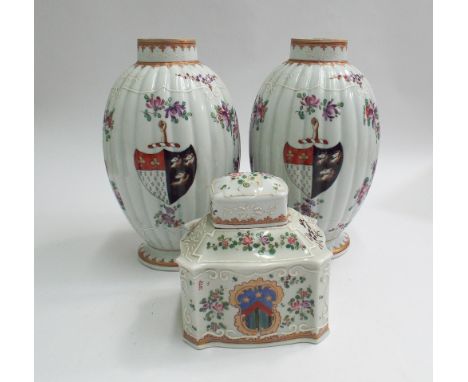 Pair of Chinese 19th century porcelain armorial ware export vases decorated with flowers, white enamel trailing design.  Cres