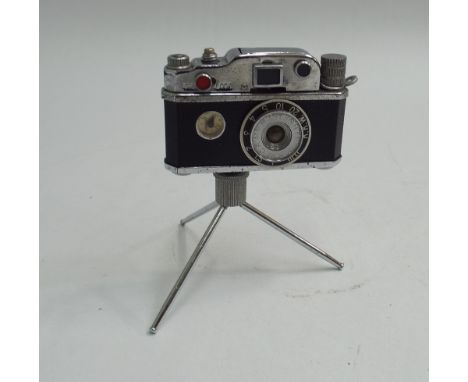 Vintage novelty table lighter modelled as a camera on a tripod