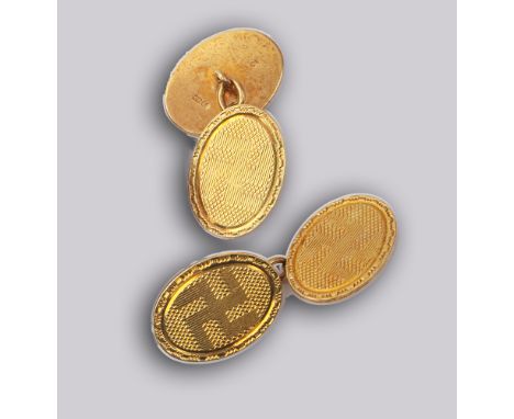 Pair of gents 18ct yellow gold cufflinks of oval form with engine turned Swastika design - weight 13.2g