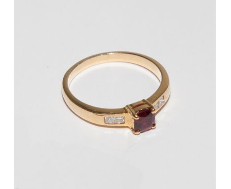 18ct yellow gold ladies dress ring set with ruby and diamonds. Ring size Q