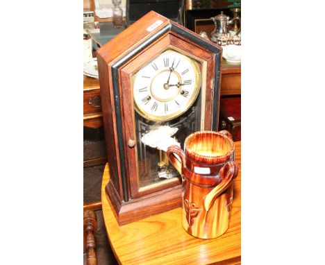 American striking shelf clock and a pottery 3 handle vase 