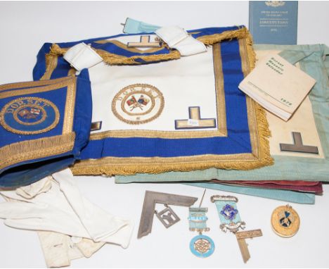 Collection of Masonic regalia including aprons, sashes, silver gilt and enamel Masonic jewels