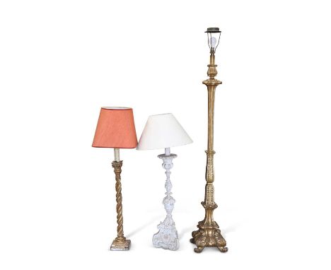 THREE 19TH CENTURY AND LATER LAMPS comprising a giltwood standard lamp, 19th/20th Century; a carved and limed wood table lamp