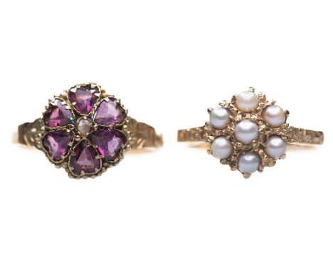 TWO CLUSTER RINGS comprising a Victorian 12 carat gold garnet and seed pearl cluster ring, with fancy engraved shoulders and 