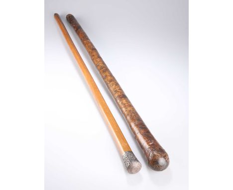 A 19TH CENTURY SILVER-TOPPED MALACCA CANE the chased silver top probably French, maker's mark ET; together with a shillelagh-