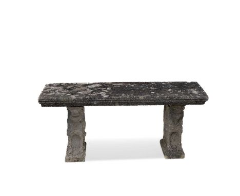 A 20TH CENTURY COMPOSITE STONE GARDEN BENCH the rectangular seat raised on griffin-form supports. 54cm high, 123cm wide