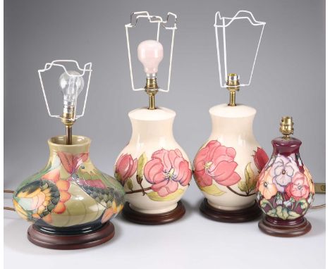 FOUR MOORCROFT POTTERY TABLE LAMPS each with a shade; together with a Royal Copenhagen vase. (5) Height of the pair to the to