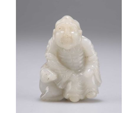 A CHINESE CARVED JADE FIGURE depicting an elderly man sitting on the back of a deer. 6.3cm highIn very good condition without