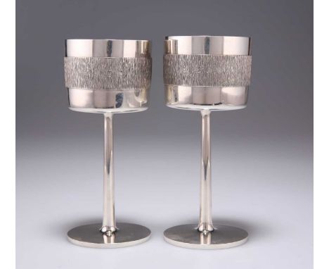 A PAIR OF ELIZABETH II SILVER GOBLETS maker R A F, London 1971, the straight sided bowls with a central girdle of bark effect